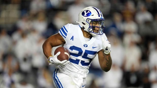 Sep 18, 2021; Provo, Utah, USA; BYU Cougars running back Tyler Allgeier (25) carries the ball in the first quarter against the Arizona State Sun Devils at LaVell Edwards Stadium. Mandatory Credit: Kirby Lee-USA TODAY Sports